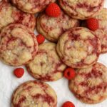 Soft lemon cookies swirled with fresh raspberries and sprinkled with flaky sea salt and lemon zest.